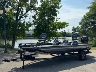 The Image of 2025 Ranger RT198P boat on trailer by a scenic lake. - 0