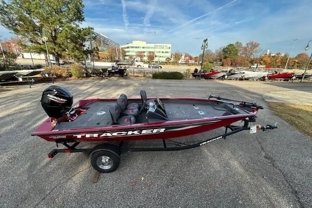 Slide: The Image of 2025 Tracker Pro Team 175 Crappie Edition boat on trailer, parked outdoors. - 5