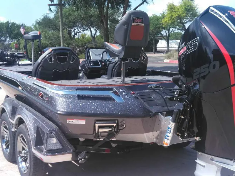 Slide: The Image of 2025 Ranger Z520R Cup-Equipped boat with powerful engine, parked outdoors. - 2