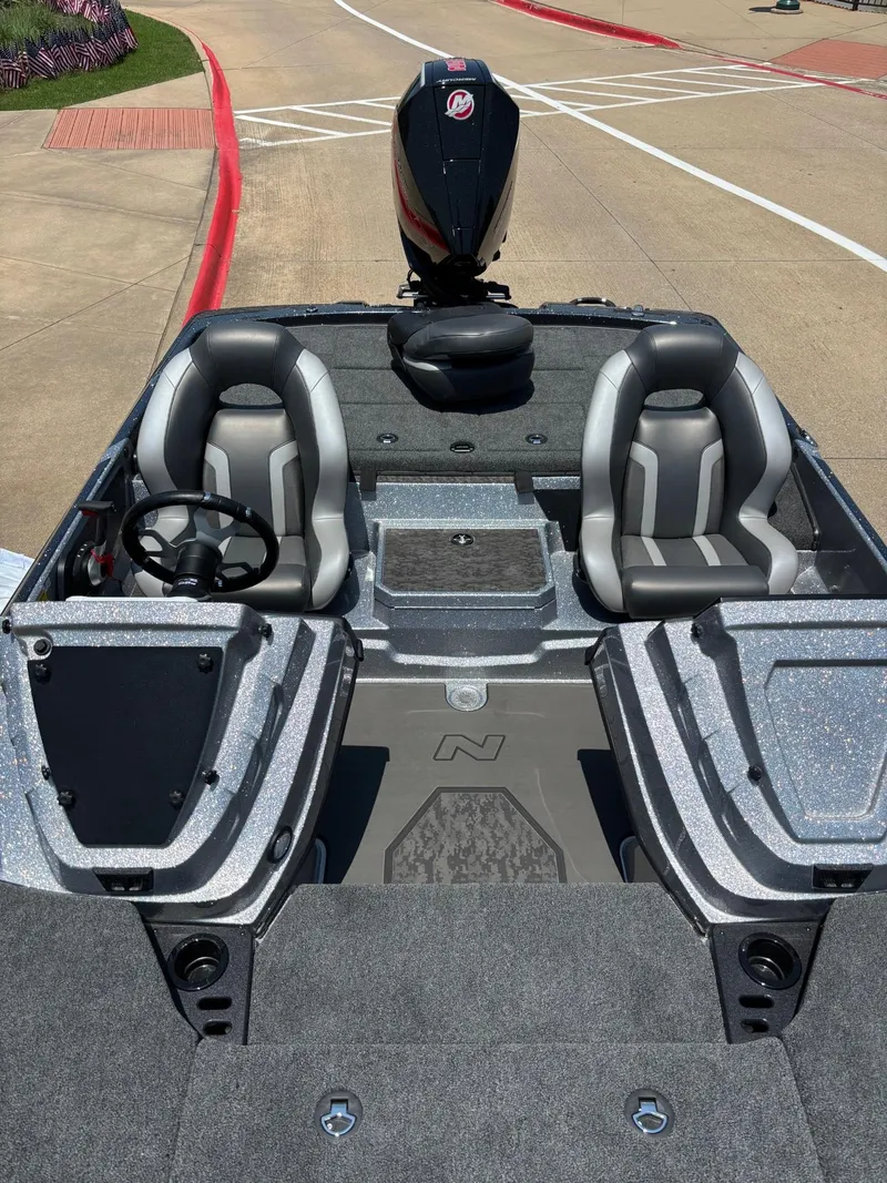 Slide: The Image of 2025 Nitro Z21 XL boat interior with dual seats and steering wheel. - 5