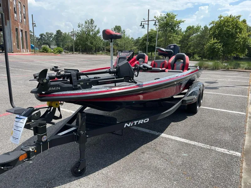 Slide: The Image of 2025 Nitro Z20 XL Pro boat in parking lot, featuring sleek design and advanced Garmin equipment. - 5