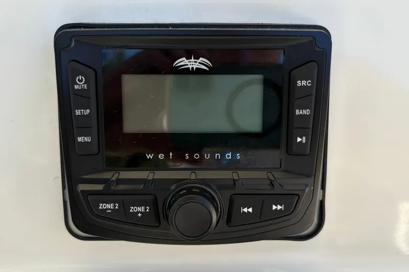 Slide: The Image of 2025 Mako 214 Center Console audio system with Wet Sounds control panel. - 18
