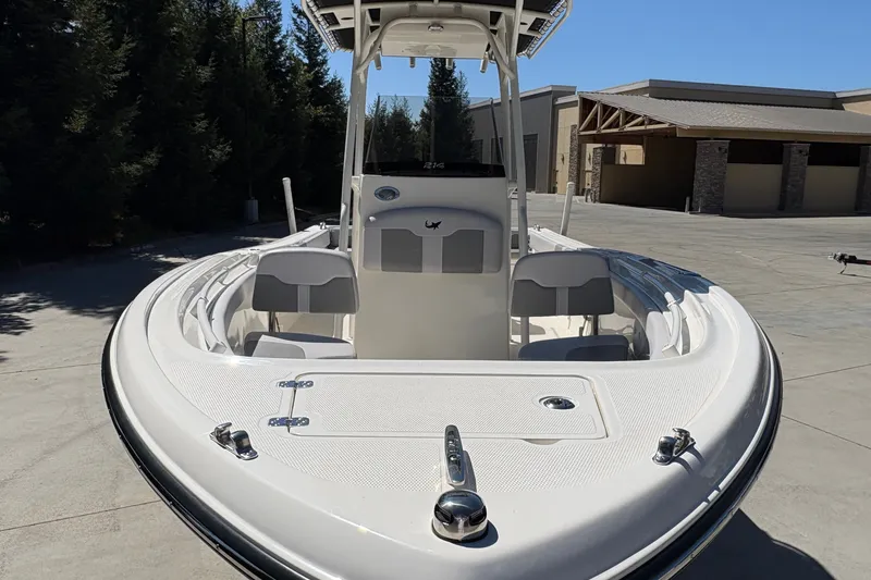 Slide: The Image of 2025 Mako 214 Center Console boat in a sunny outdoor setting. - 16