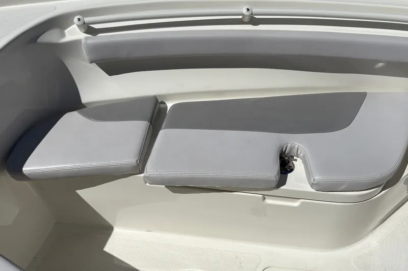 Slide: The Image of 2025 Mako 214 Center Console boat with cushioned seating area. - 24