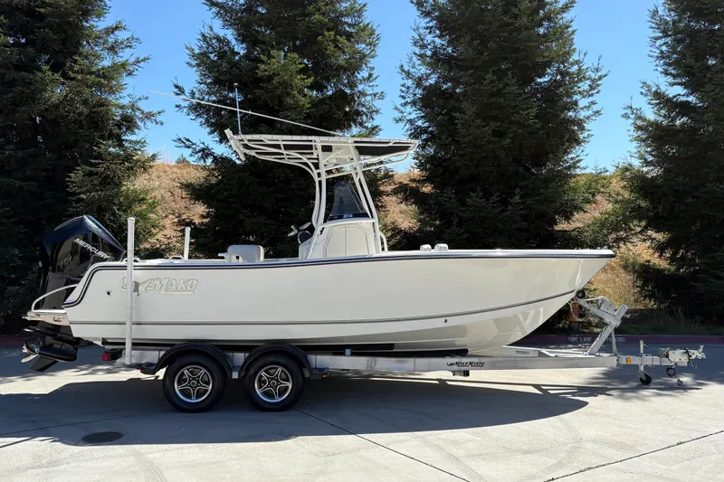 The Image of 2025 Mako 214 Center Console boat on trailer, parked outdoors. - 0