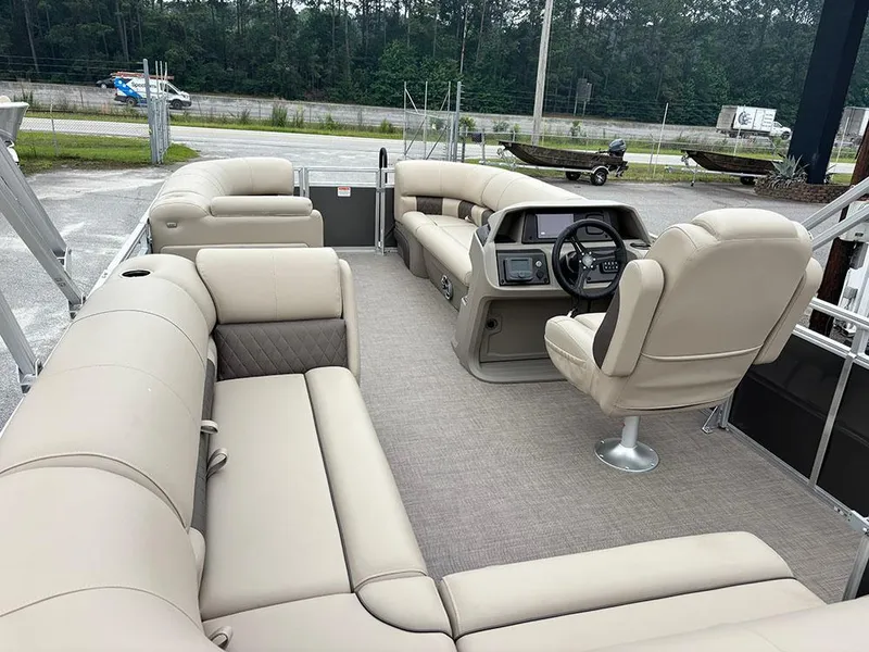 Slide: The Image of 2025 Sun Tracker Party Barge 20 DLX with spacious seating and modern helm. - 11