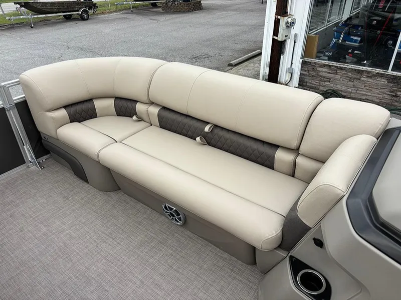 Slide: The Image of 2025 Sun Tracker Party Barge 20 DLX, beige seating, outdoor setting. - 14