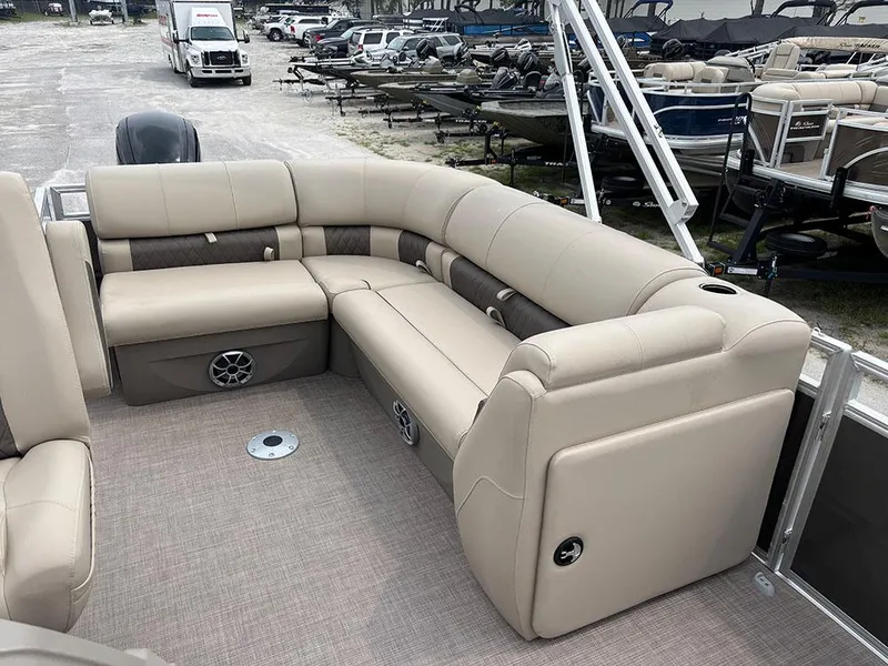 Slide: The Image of 2025 Sun Tracker Party Barge 20 DLX with beige seating, spacious layout, and modern design. - 18
