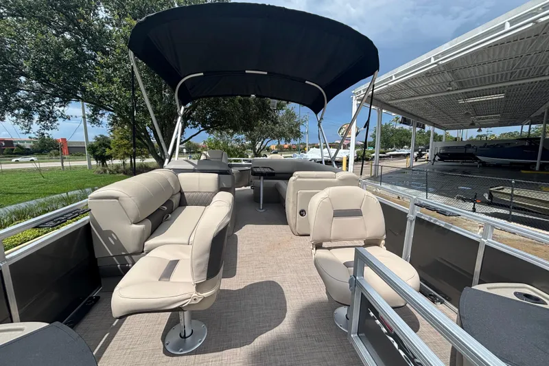 Slide: The Image of 2025 Sun Tracker Fishin' Barge 20 DLX pontoon boat with spacious seating and canopy. - 57