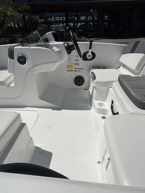 Slide: The Image of 2025 Tahoe T16 boat interior with white seating and steering console. - 7