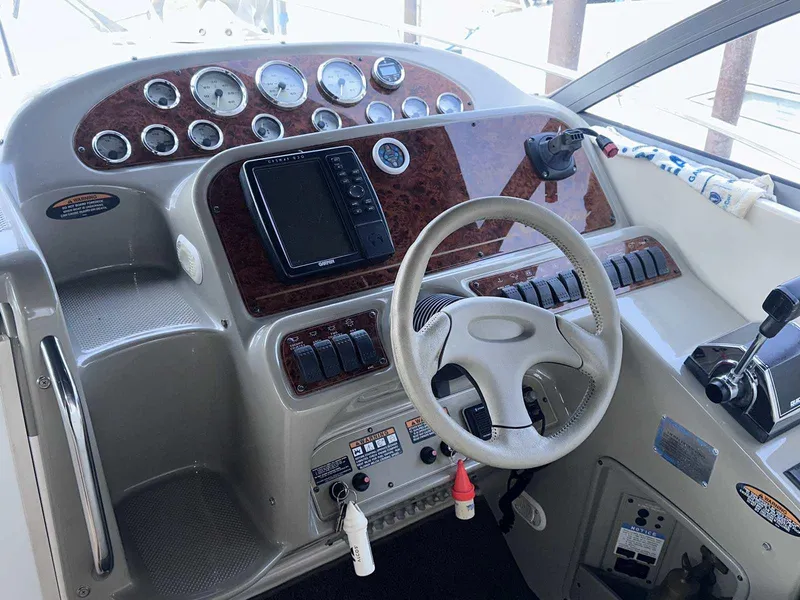 Slide: The Image of Cockpit of 2000 Bayliner 3055 Ciera Sunbridge DX/LX with steering wheel and instrument panel. - 11