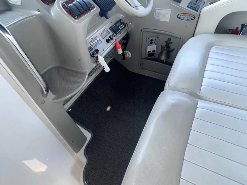 Slide: The Image of Interior of 2000 Bayliner 3055 Ciera Sunbridge DX/LX boat cockpit with seating and controls. - 12