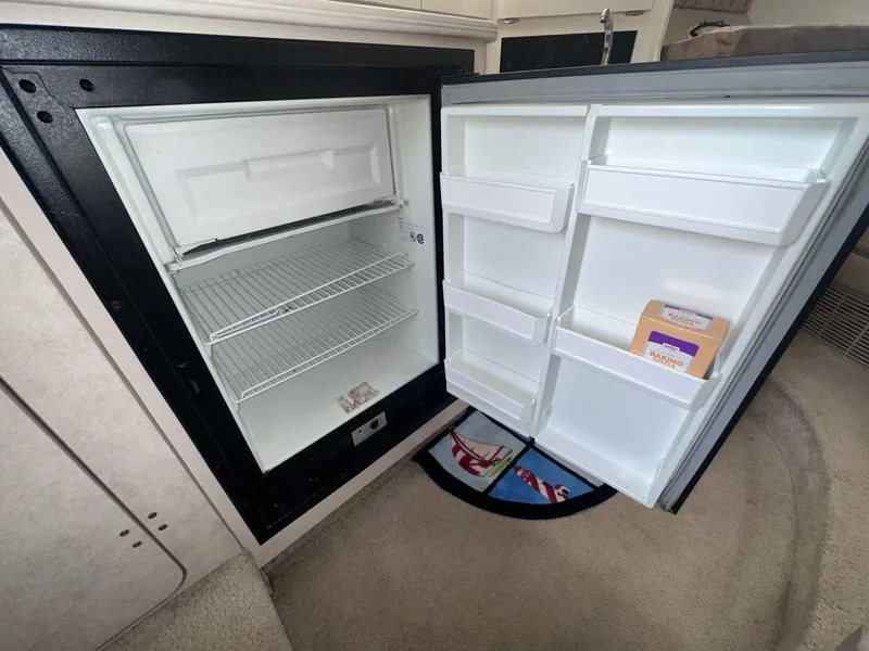 Slide: The Image of Open refrigerator inside 2000 Bayliner 3055 Ciera Sunbridge DX/LX boat cabin. - 19
