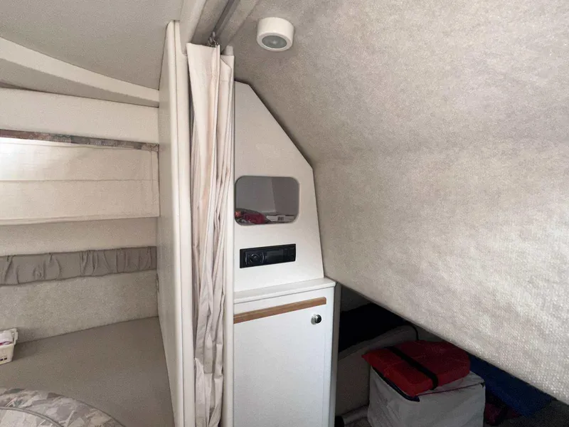 Slide: The Image of Interior cabin of 2000 Bayliner 3055 Ciera Sunbridge DX/LX with compact storage and seating. - 22