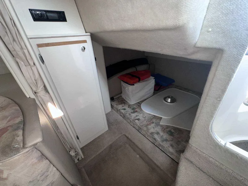 Slide: The Image of Interior cabin of 2000 Bayliner 3055 Ciera Sunbridge DX/LX with storage and seating area. - 24