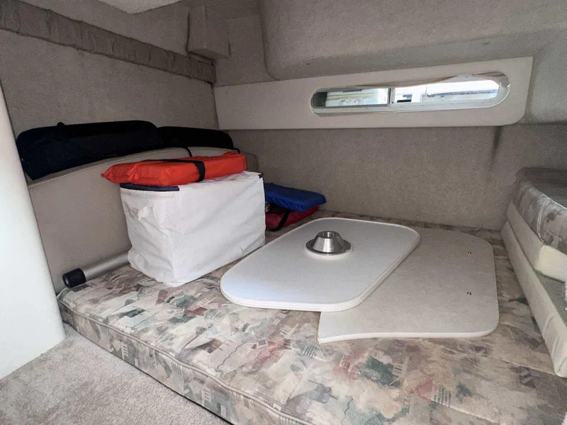 Slide: The Image of Interior cabin of 2000 Bayliner 3055 Ciera Sunbridge with cushions and storage. - 25