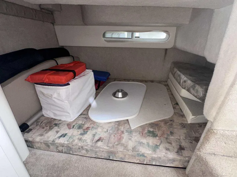 Slide: The Image of Interior cabin of 2000 Bayliner 3055 Ciera Sunbridge DX/LX with seating and storage. - 27