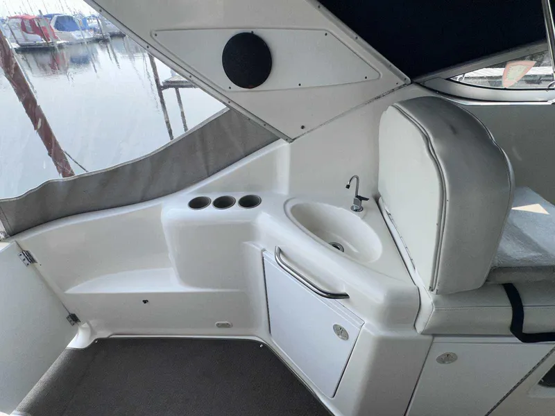 Slide: The Image of 2000 Bayliner 3055 Ciera Sunbridge DX/LX interior with sink and seating area. - 6