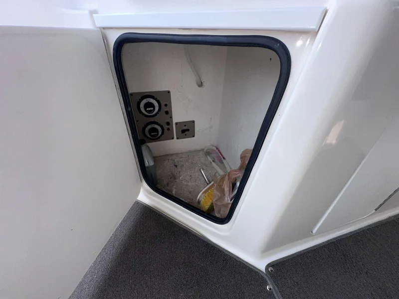 Slide: The Image of Storage compartment on a 2000 Bayliner 3055 Ciera Sunbridge DX/LX boat. - 7