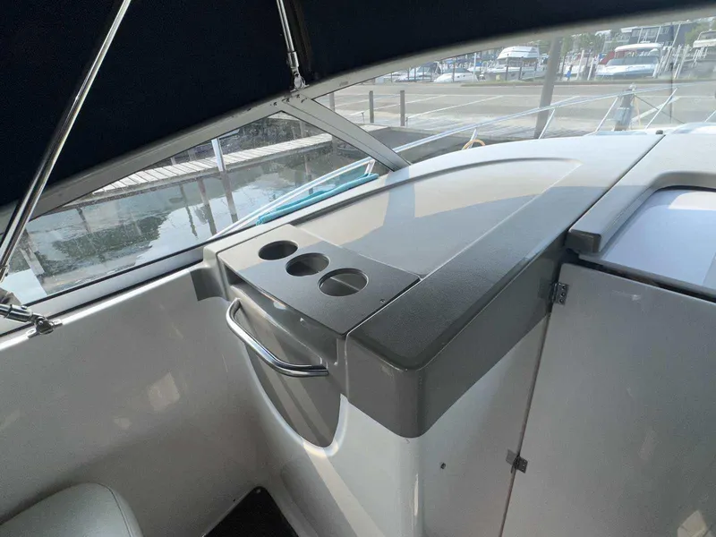 Slide: The Image of Interior view of a 2000 Bayliner 3055 Ciera Sunbridge DX/LX boat with cup holders. - 9