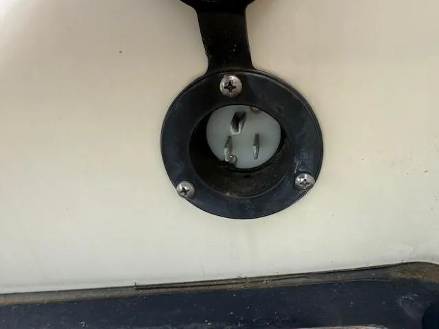 Slide: The Image of 2014 Chris-Craft Launch 25 boat power outlet close-up. - 10