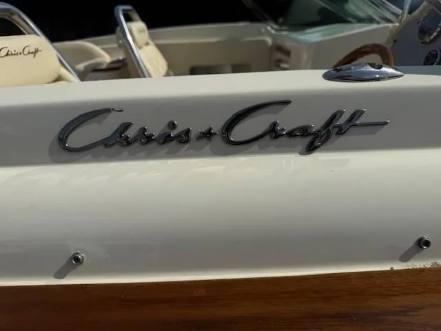 Slide: The Image of 2014 Chris-Craft Launch 25 boat, featuring elegant branding and luxurious interior details. - 12