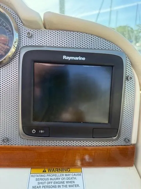 Slide: The Image of Raymarine display on 2014 Chris-Craft Launch 25 dashboard with warning label. - 17