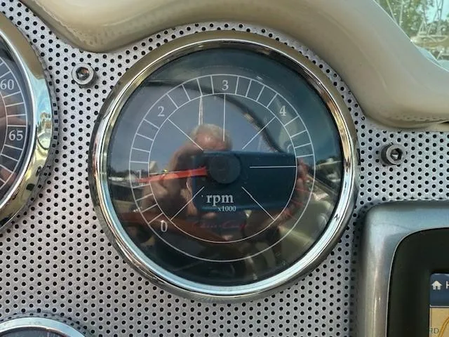 Slide: The Image of Tachometer of 2014 Chris-Craft Launch 25 boat, displaying RPM gauge. - 19