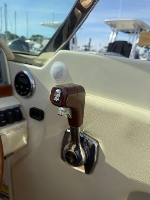 Slide: The Image of 2014 Chris-Craft Launch 25 throttle control in a boat cockpit, showcasing luxury design. - 23