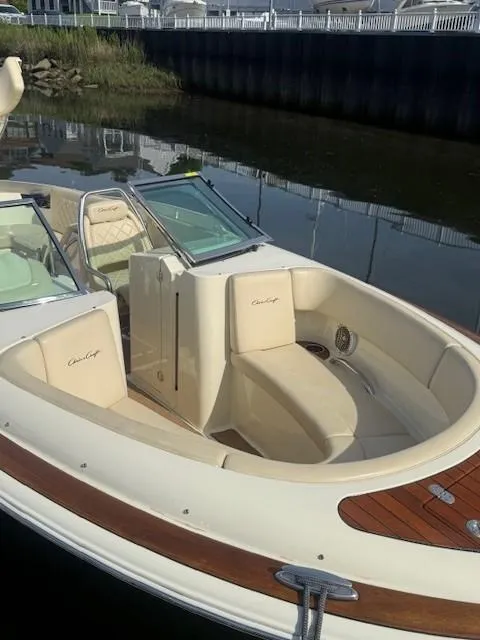 Slide: The Image of 2014 Chris-Craft Launch 25 boat with elegant seating and classic design. - 27