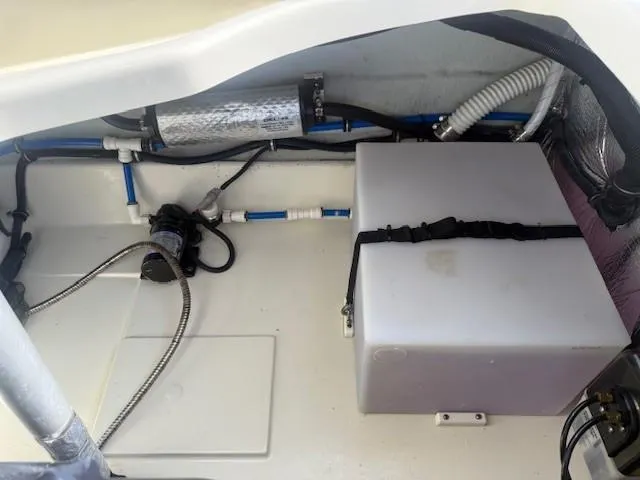 Slide: The Image of 2014 Chris-Craft Launch 25 engine compartment with visible wiring and components. - 37