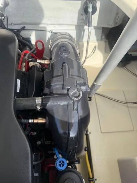 Slide: The Image of Engine compartment of a 2014 Chris-Craft Launch 25 boat, showcasing mechanical components. - 38