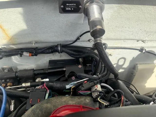 Slide: The Image of Engine compartment of a 2014 Chris-Craft Launch 25 boat, showing wiring and components. - 41