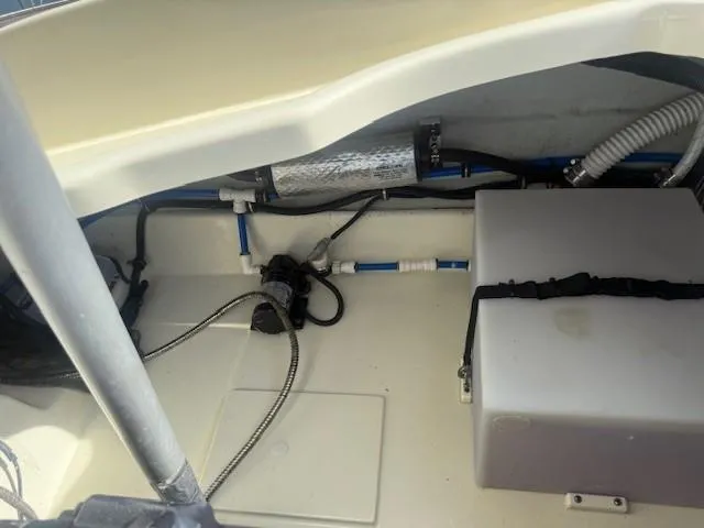 Slide: The Image of 2014 Chris-Craft Launch 25 interior showing storage compartment and mechanical components. - 43