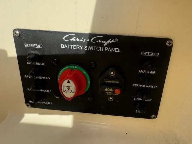 Slide: The Image of Battery switch panel on 2014 Chris-Craft Launch 25 boat, featuring various controls and switches. - 47
