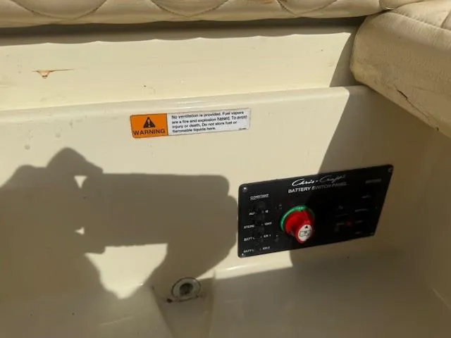 Slide: The Image of 2014 Chris-Craft Launch 25 battery switch panel with warning label. - 49