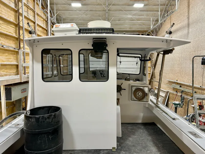 Slide: The Image of 1980 Holland 32 boat interior in a workshop setting. - 13