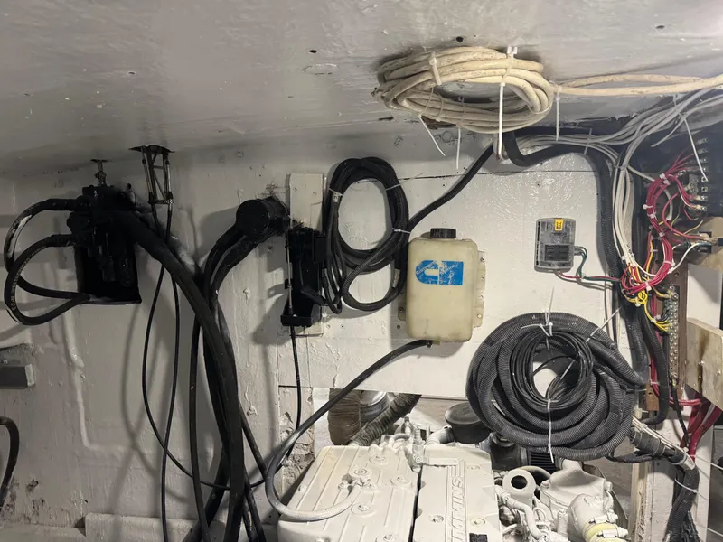Slide: The Image of Engine room of 1980 Holland 32 boat with cables and equipment. - 14