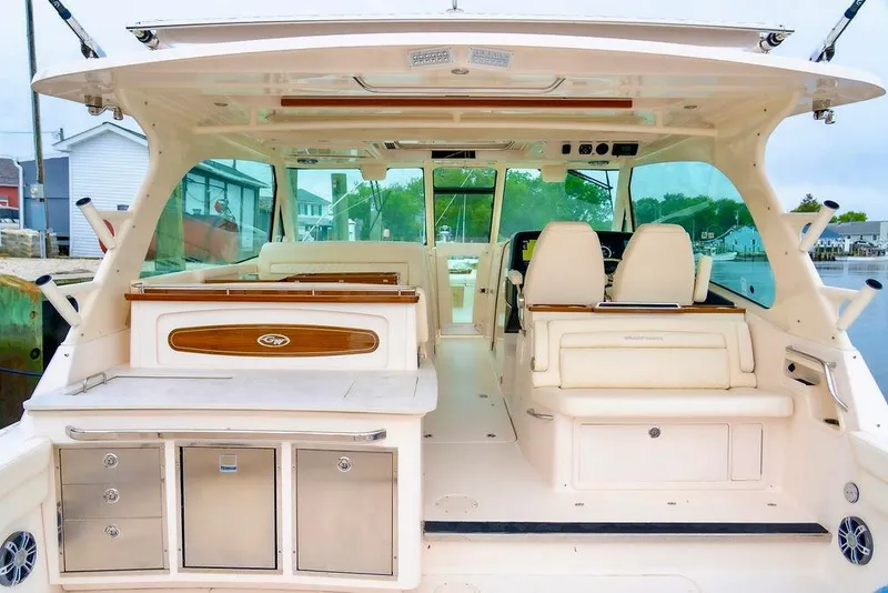 Slide: The Image of 2024 Grady-White Freedom 415 boat interior with seating and storage. - 13