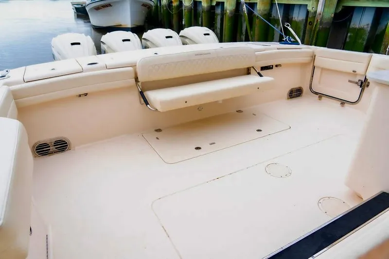 Slide: The Image of 2024 Grady-White Freedom 415 boat deck with seating and outboard motors. - 17