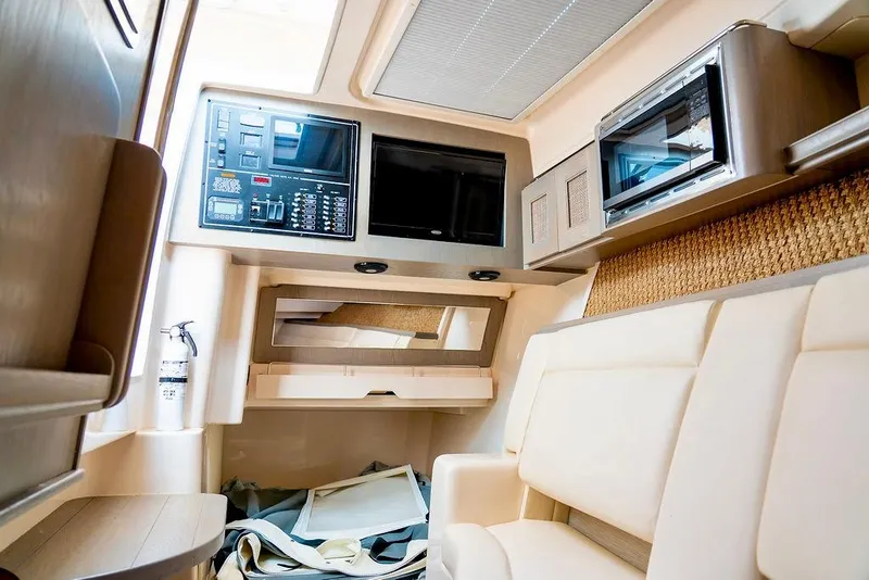 Slide: The Image of 2024 Grady-White Freedom 415 cabin interior with modern amenities and comfortable seating. - 21