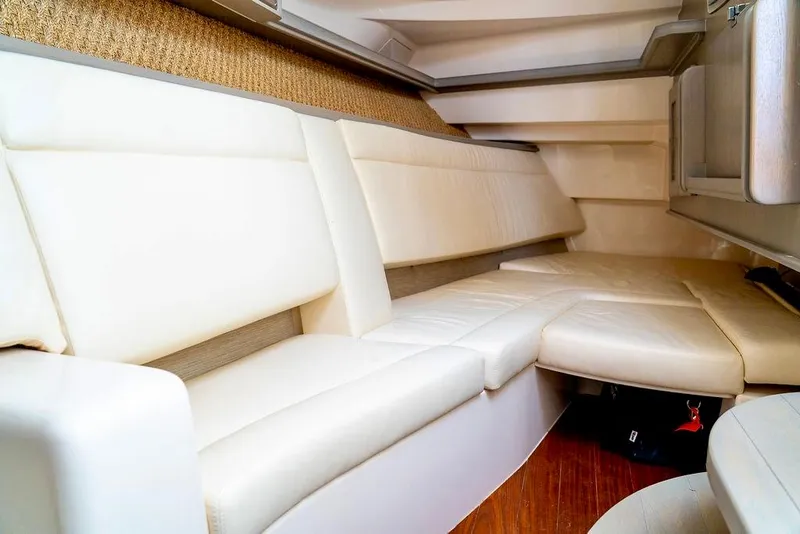 Slide: The Image of 2024 Grady-White Freedom 415 interior with plush cream seating and wood flooring. - 22