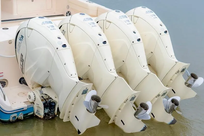 Slide: The Image of 2024 Grady-White Freedom 415 boat with four powerful outboard engines. - 23