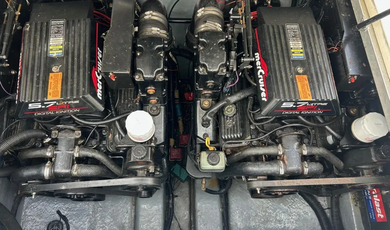 Slide: The Image of Twin MerCruiser engines in a 1998 Sea Ray 290 Sundancer boat. - 14