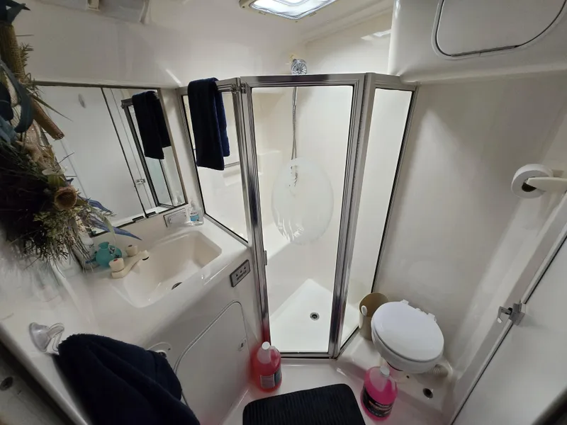 Slide: The Image of Bathroom interior of 1996 Silverton 37 Convertible yacht with shower and sink. - 14
