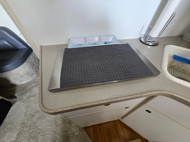 Slide: The Image of Interior of 1996 Silverton 37 Convertible with countertop and sink area. - 18