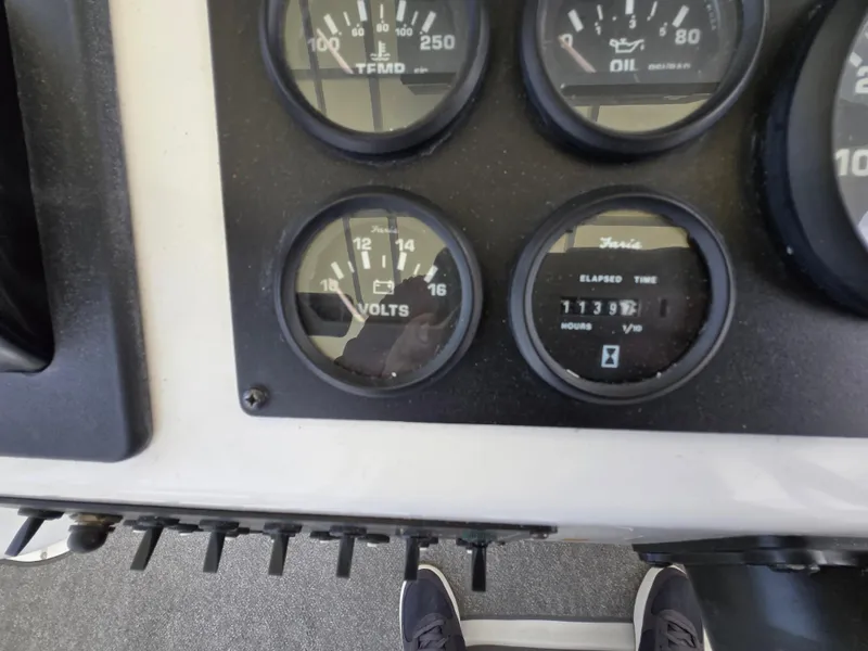 Slide: The Image of Instrument panel of a 1996 Silverton 37 Convertible boat showing gauges and elapsed time. - 32