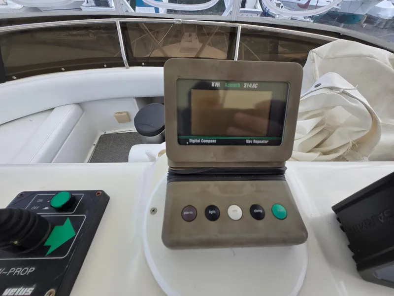 Slide: The Image of Control panel on a 1996 Silverton 37 Convertible boat, featuring navigation and control buttons. - 34