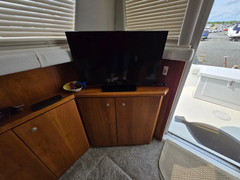Slide: The Image of Interior of 1996 Silverton 37 Convertible with TV on wooden cabinet. - 47