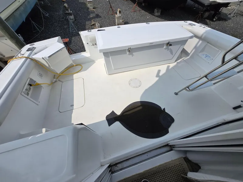 Slide: The Image of 1996 Silverton 37 Convertible boat deck with storage and a flatfish on the floor. - 48